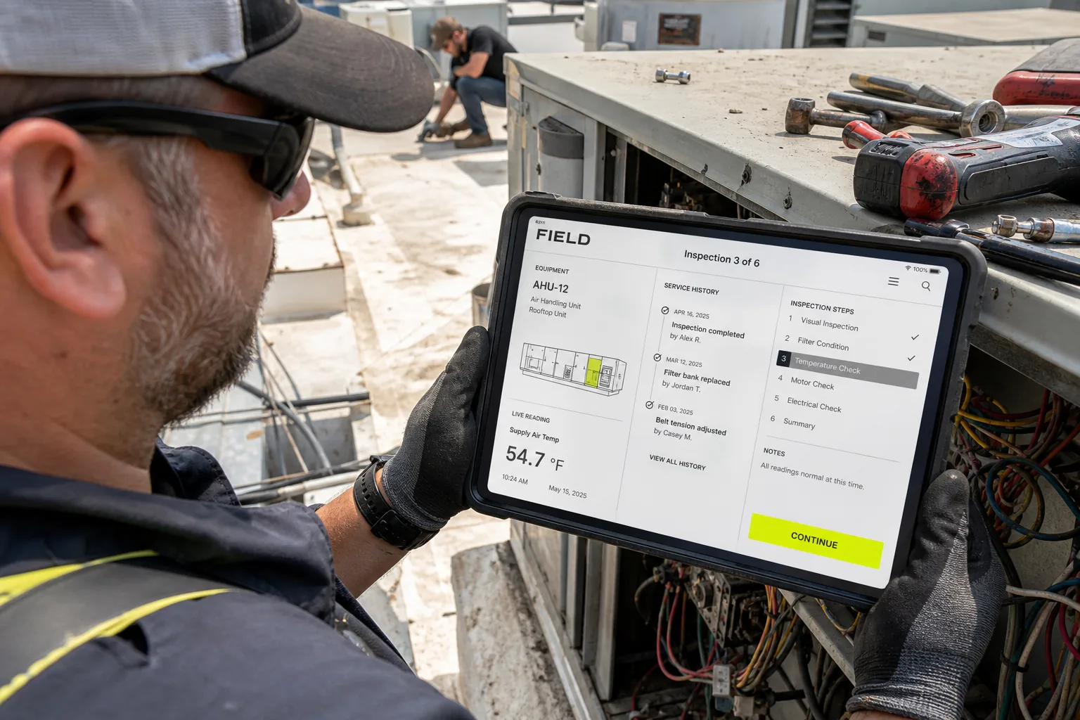 Technician using the FIELD service agent on a rugged tablet
